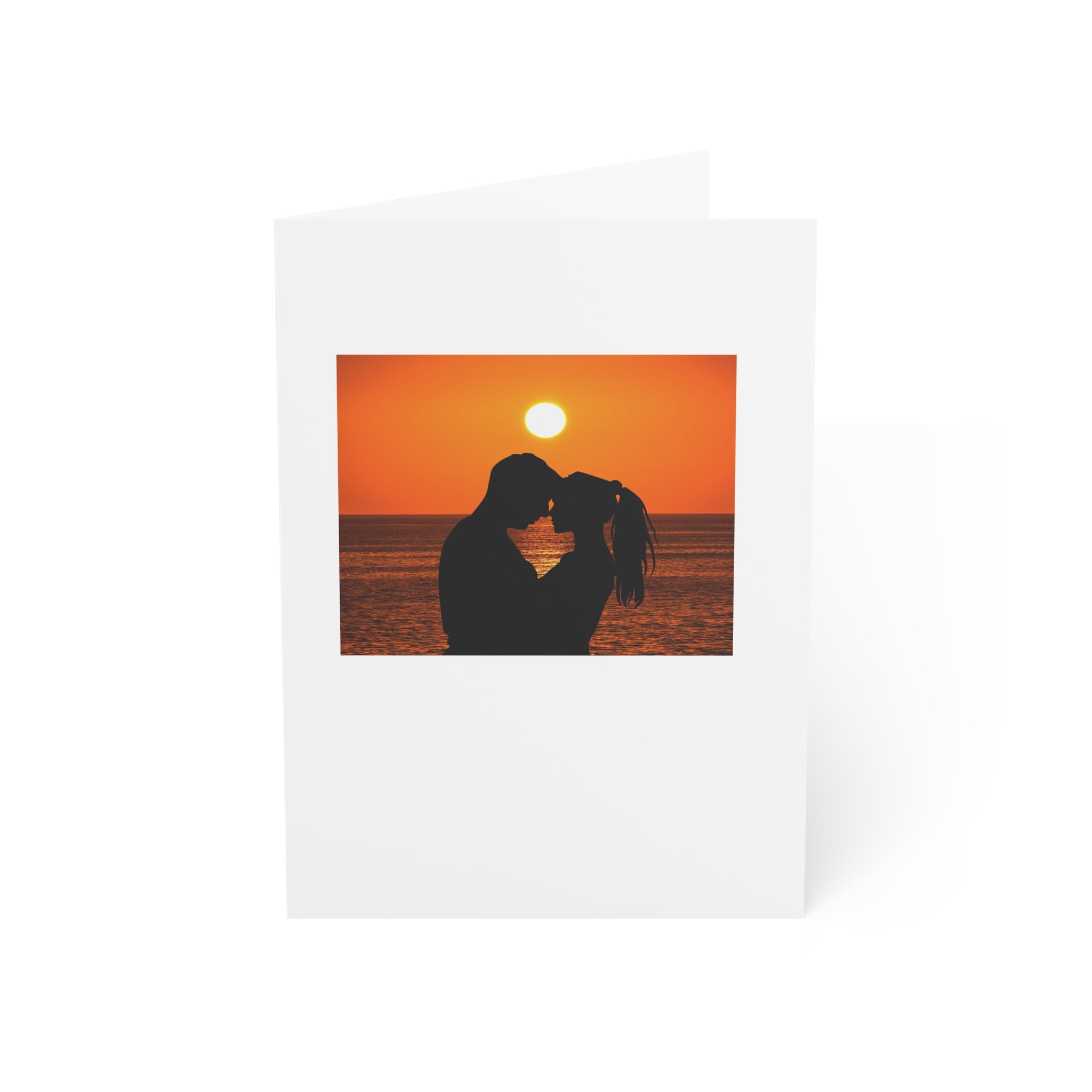 Greeting Cards - Couple on a beach at sunset